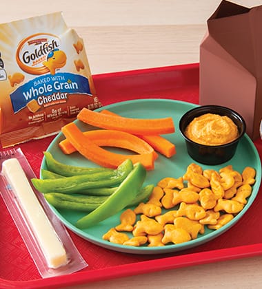 MIX AND DIP HUMMUS LUNCH SERVED WITH GOLDFISH® MADE WITH WHOLE GRAIN CHEDDAR