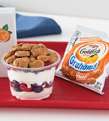 SMILING YOGURT PARFAITS MADE WITH GOLDFISH® GRAHAMS BAKED WITH WHOLE GRAIN FRENCH TOAST