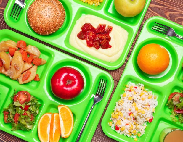 Global Flavors in K-12 Schools - cafeteria trays with food