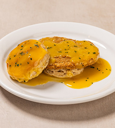 SMOTHERED CHICKEN BISCUIT SANDWICH