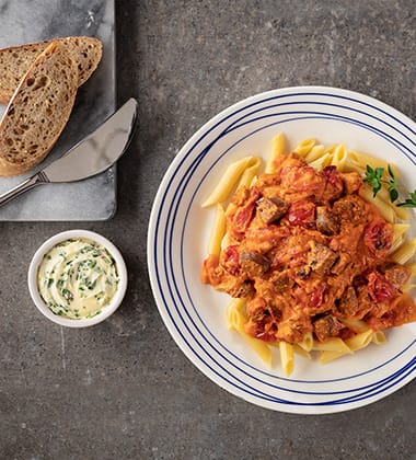 ITALIAN SAUSAGE WITH PASTA MADE WITH CAMPBELL’S® RESERVE ROASTED RED PEPPER & SMOKED GOUDA